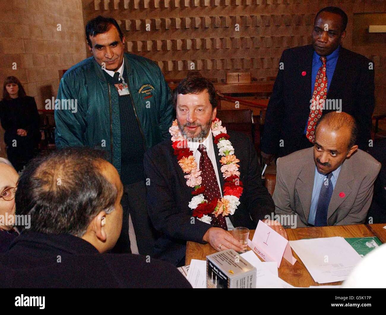 Home Secretary David Blunkett talks with community representatives during his visit to a multi-faith community centre in Balsall Heath in Birmingham. * Immigrants should have to swear an oath of allegiance to show their clear primary loyalty to Britain, a report into this summer's race riots said today. The controversial suggestion in the Cantle Report, which was commissioned by Blunkett, goes even further than his recent comments that new arrivals should learn English and adopt British norms. Stock Photo