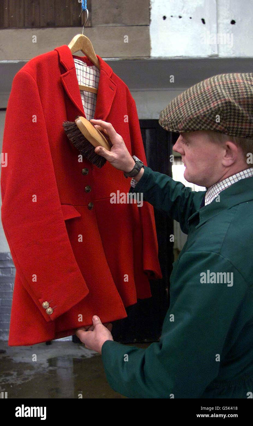 Cleaning the hunting outfits is huntsman Robert McCarthy at the Essex