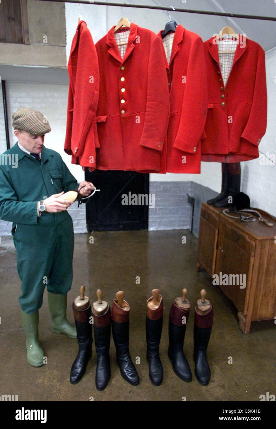 Cleaning the hunting outfits is huntsman Robert McCarthy at the Essex