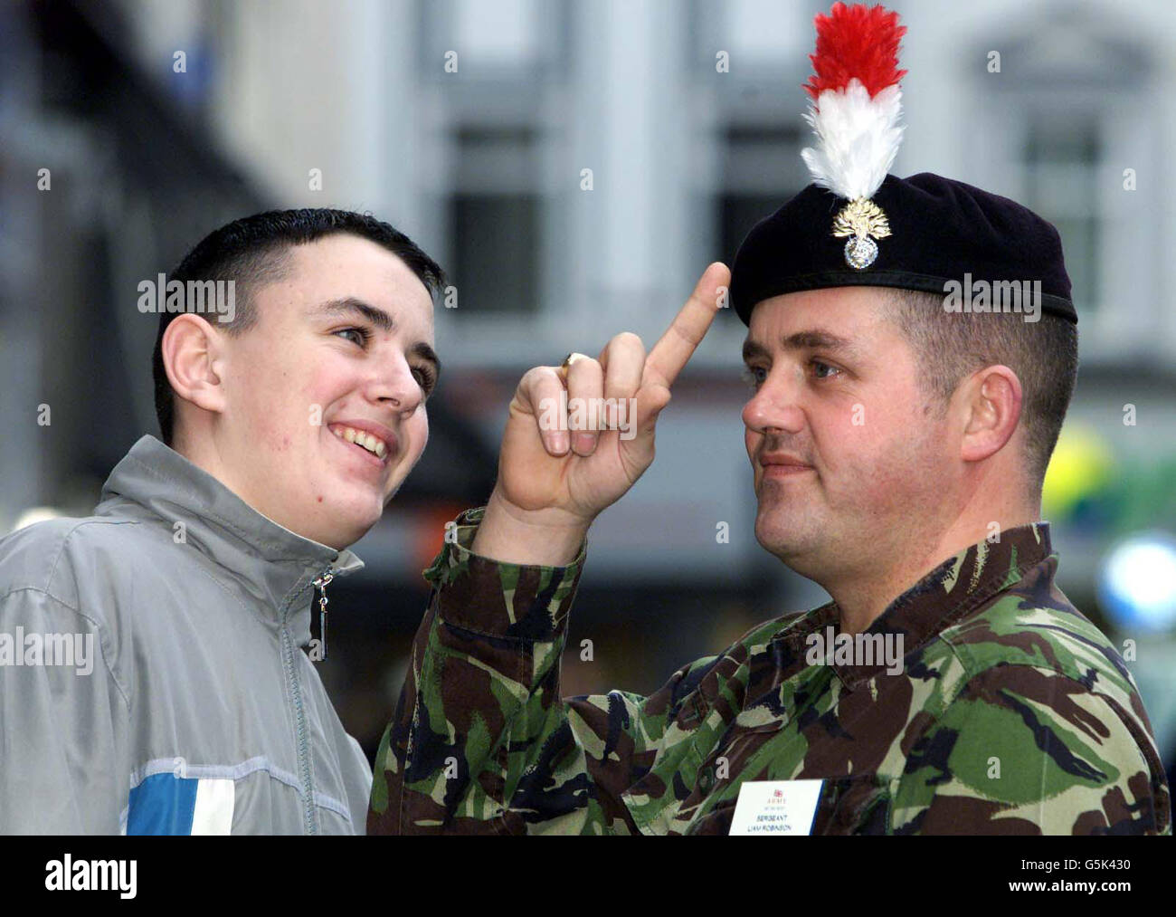 Actor from the film 'Billy Elliot' Stuart Wells, 19 (left) poses with Recruiting Officer Sergeant Liam Robinson of the 1st Battalion Royal Regiment Of Fusiliers in Newcastle, after deciding to give up his acting career to enlist. * Stuart Wells from Wallsend, North Tyneside who played Billy's best friend Michael in the film about a boy with a passion for ballet, was finally persuaded to enlist by his brother John, 17, who is already serving with the Fusiliers in Germany. He is currently starring in ITV's hit drama Peak Practice and recently returned from three months on location in Spain with Stock Photo