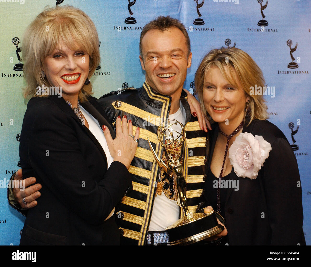 British actresses Joanna Lumley (L) and Jennifer Saunders (R), stars of 'Absolutely Fabulous' pose with British talk show host Graham Norton, at the 29th International Emmy Awards, in New York City. *...Norton won the Popular Arts category with his Channel 4 show, 'So Graham Norton-Show 18'. Lumley and Saunders were presenters during the event. lllll Stock Photo