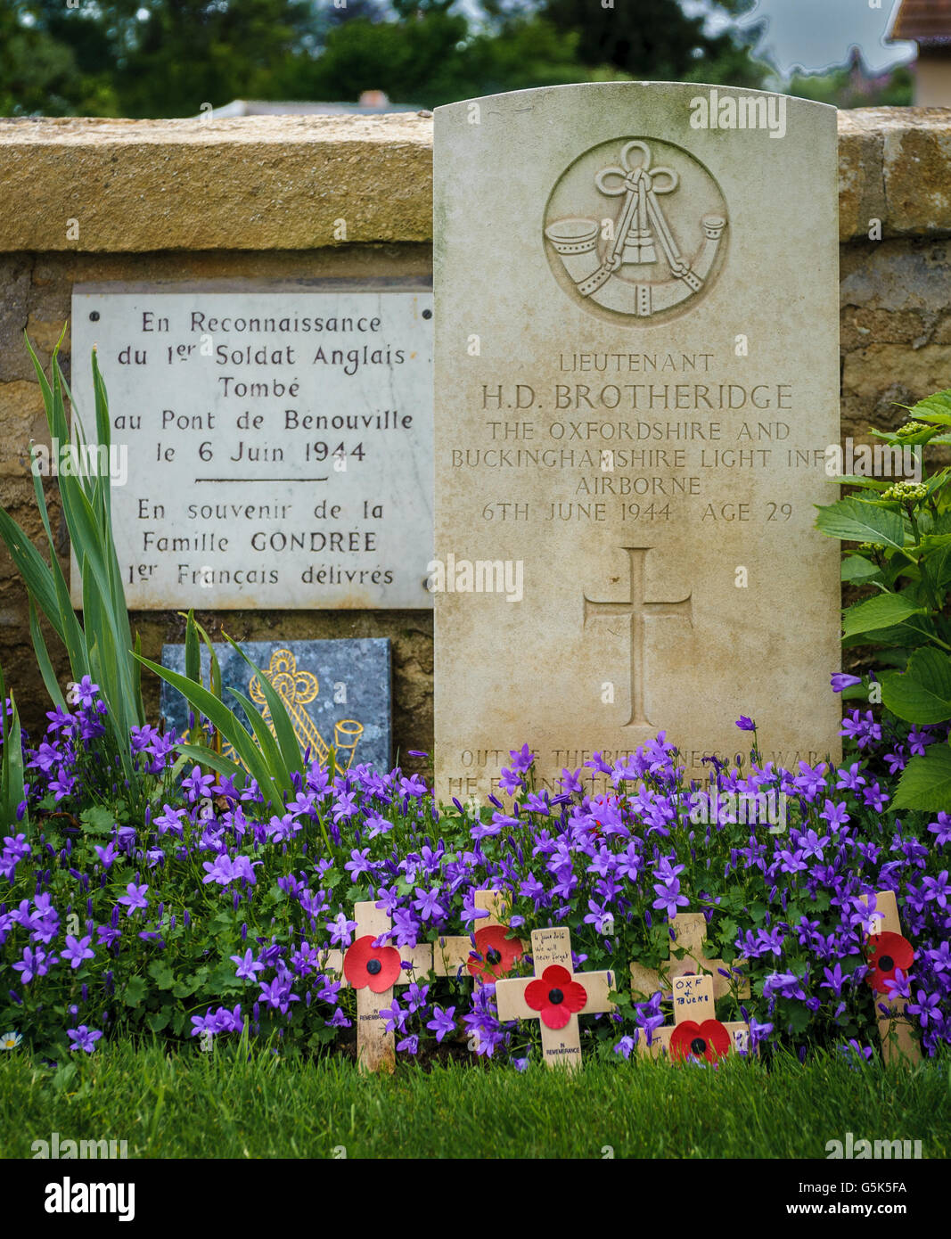 Ranville, Normandy France – The grave of Lieutenant Brotheridge, the first allied soldier to be killed in action on D Day at Pegasus Bridge Stock Photo