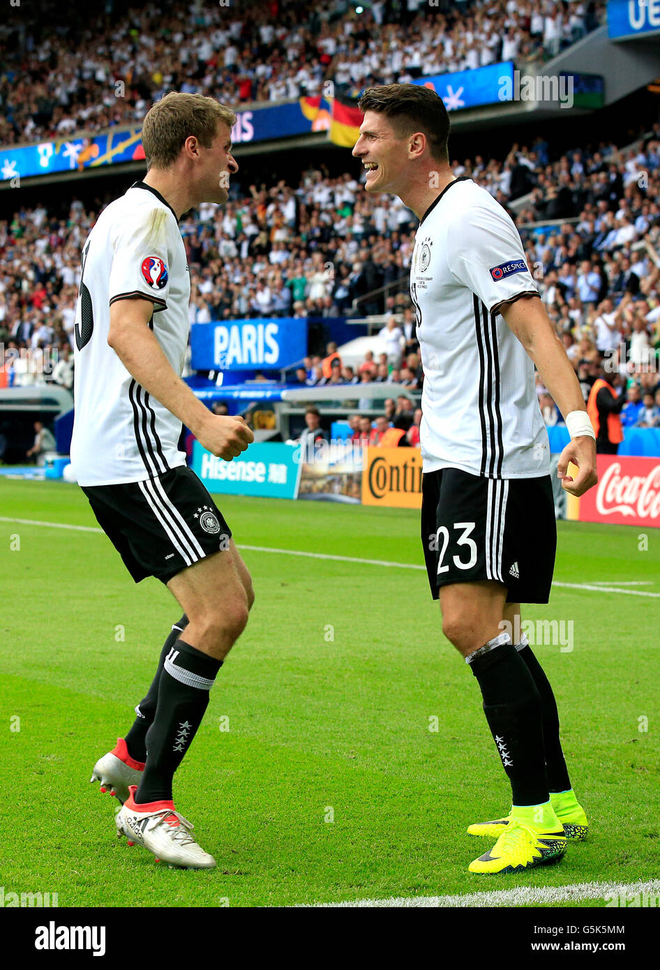 Germany's Mario Gomez (right) celebrates scoring their first goal of the game with team-mate Thomas Muller during the UEFA Euro 2016, Group C match at the Parc Des Princes, Paris. Stock Photo