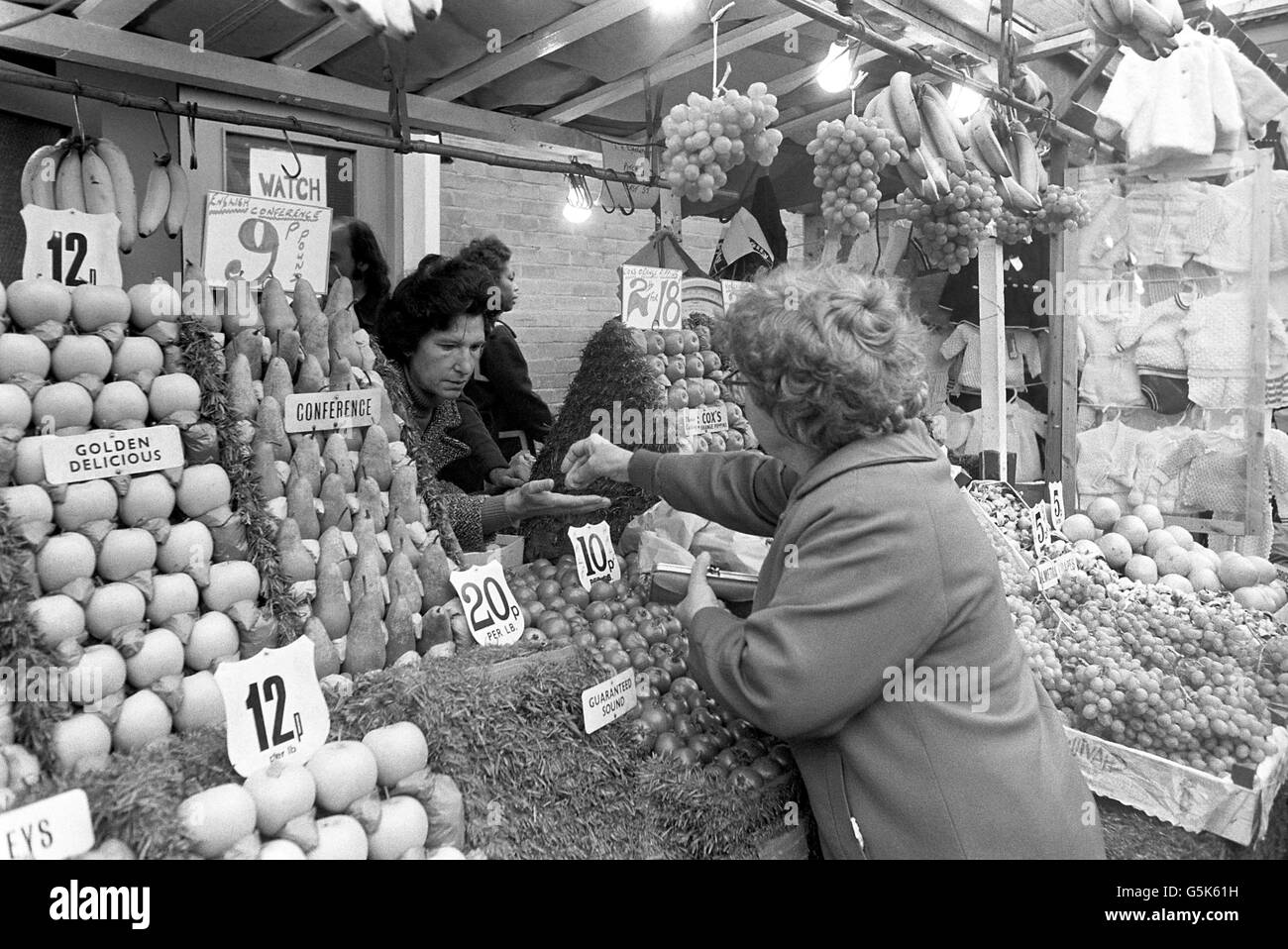 Pensioner goes food shopping. 3.29-a-week pension to pay for goods at the greengrocers. Stock Photo