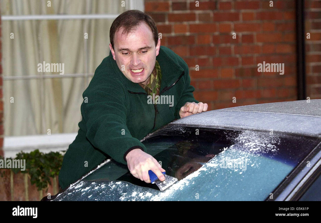 Major Charles Ingram, who serves with the Royal Engineers, removes the ice from his car before departing from his home in Wiltshire. Mr Ingram and his wife Diana were yesterday morning arrested at their Wiltshire home. *... following allegations about the officer's , 1 million jackpot win on the popular television quiz show ITV's Who wants to be a Millionaire? The Ingrams were last night released on police bail to return to a central London police station in December. Stock Photo