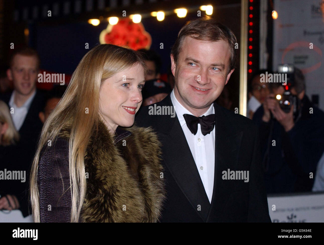 Harry Enfield and his wife Lucy arrive for the London Film Festival's closing gala premiere of his new film K-Pax at the Empire in Leicester Square, London. The film follows the story of a mysterious hospital patient who claims to be from another planet. Stock Photo