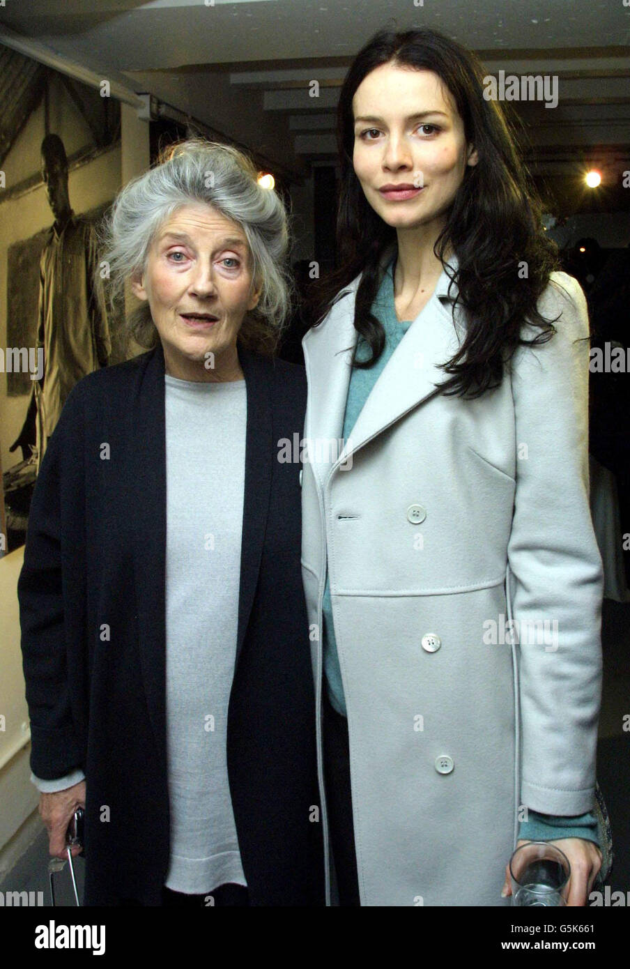 Actress Saffron Burrows with Emma Thompson's mother Phyllida Law, during the 'Broken Landscape' private view at the OXO Tower in London. The exhibition of photographs from photojournalist Gideon Mendel depict the plight of Africa and the AIDS crisis. Stock Photo