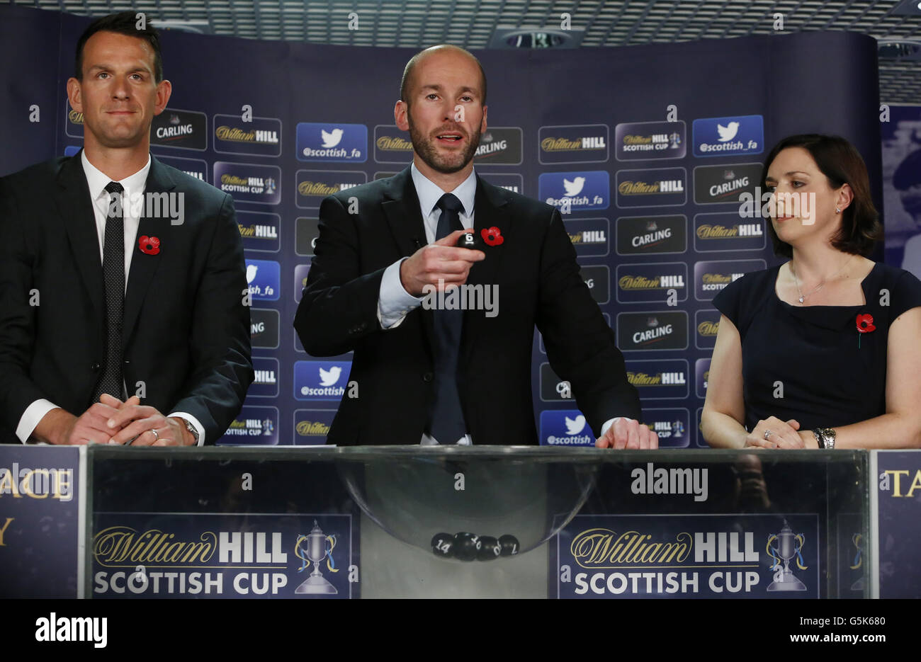 Kenny MacLeod (centre) Commercial Director Scottish FA, Jan Vennegoor of Hesselink (left) and Lyndsay Wright (Right) Director of Investor Relations William Hill are pictured during the William Hill Scottish Cup 4th round draw at Museum Hampden Park in Glasgow. Monday November 05, 2012: Danny Lawson/PA Wire Stock Photo
