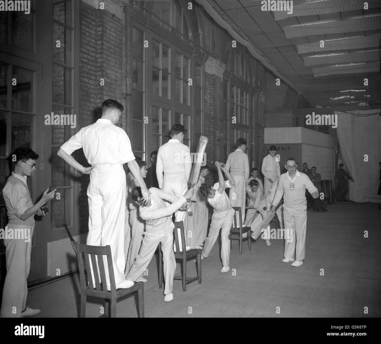 Cricket coach Harry Crabtree teaches young trainees Alexandra Palace in London Stock Photo Alamy