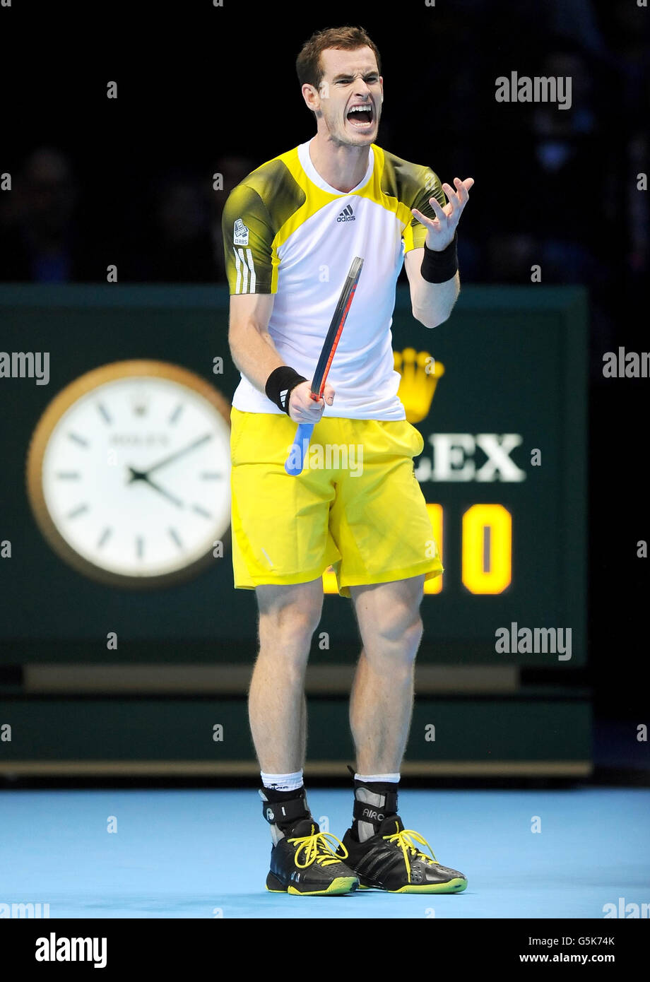 Great Britain's Andy Murray shows his frustration on his way to defeat by Serbia's Novak Djokovic during the Barclays ATP World Tour Finals at the O2 Arena, London. Stock Photo