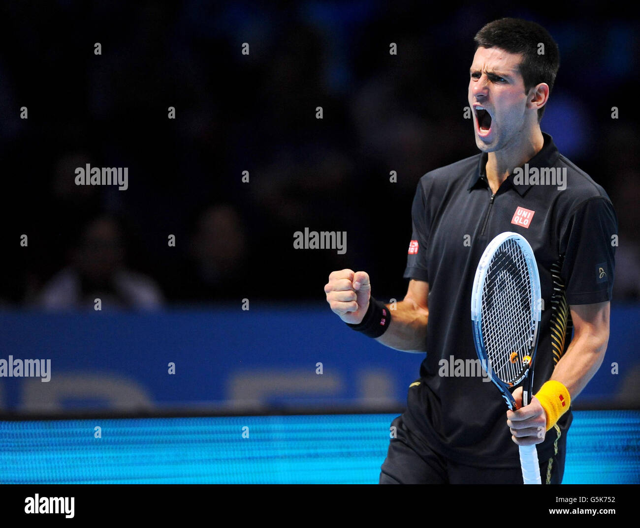 Serbia's Novak Djokovic celebrates winning a point during his match against Great Britain's Andy Murray during the Barclays ATP World Tour Finals at the O2 Arena, London. Stock Photo