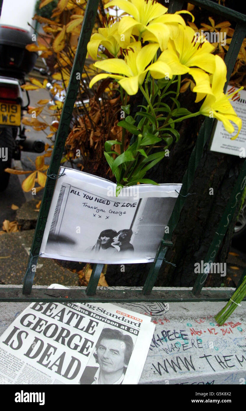 Tributes for the late George Harrison are being laid outside the ...