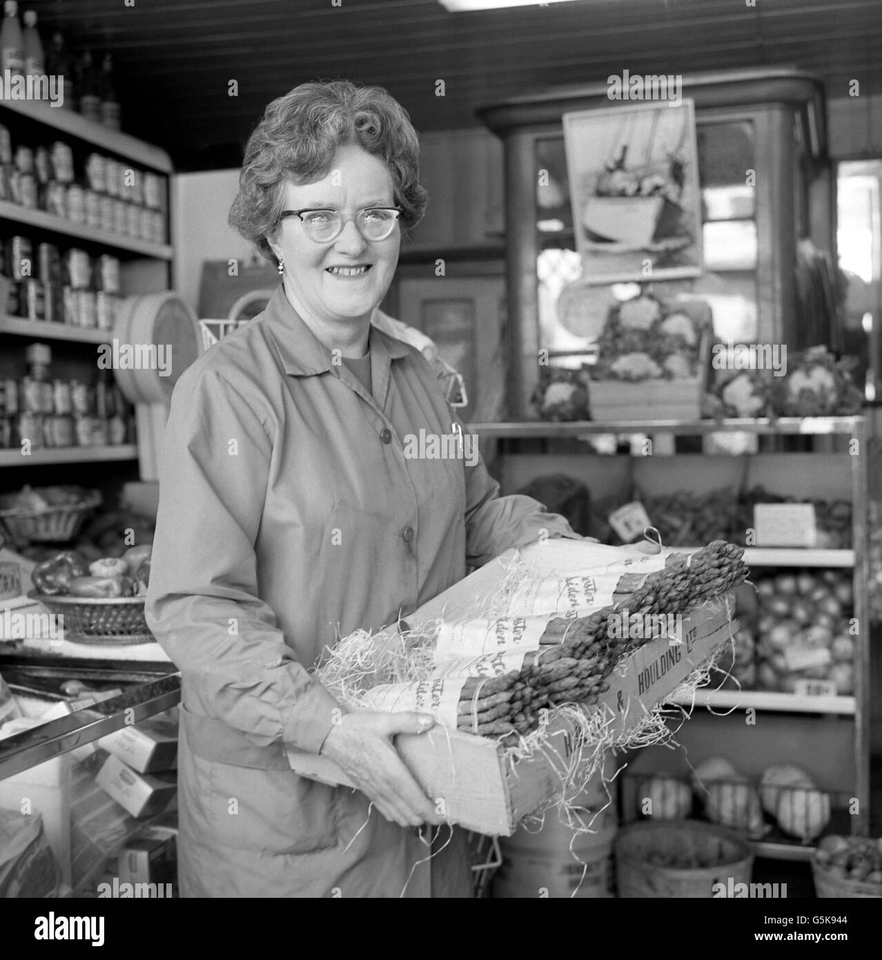 Dorothy Rose, the wife of yachtsman Alec Rose, performs her shopkeeping duties at their greengrocery business in Portsmouth as she awaits her husband's return. The lone sailor is currently on a round-the-world trip in his 36ft vessel Lively Lady and has been sailing since last July. Stock Photo