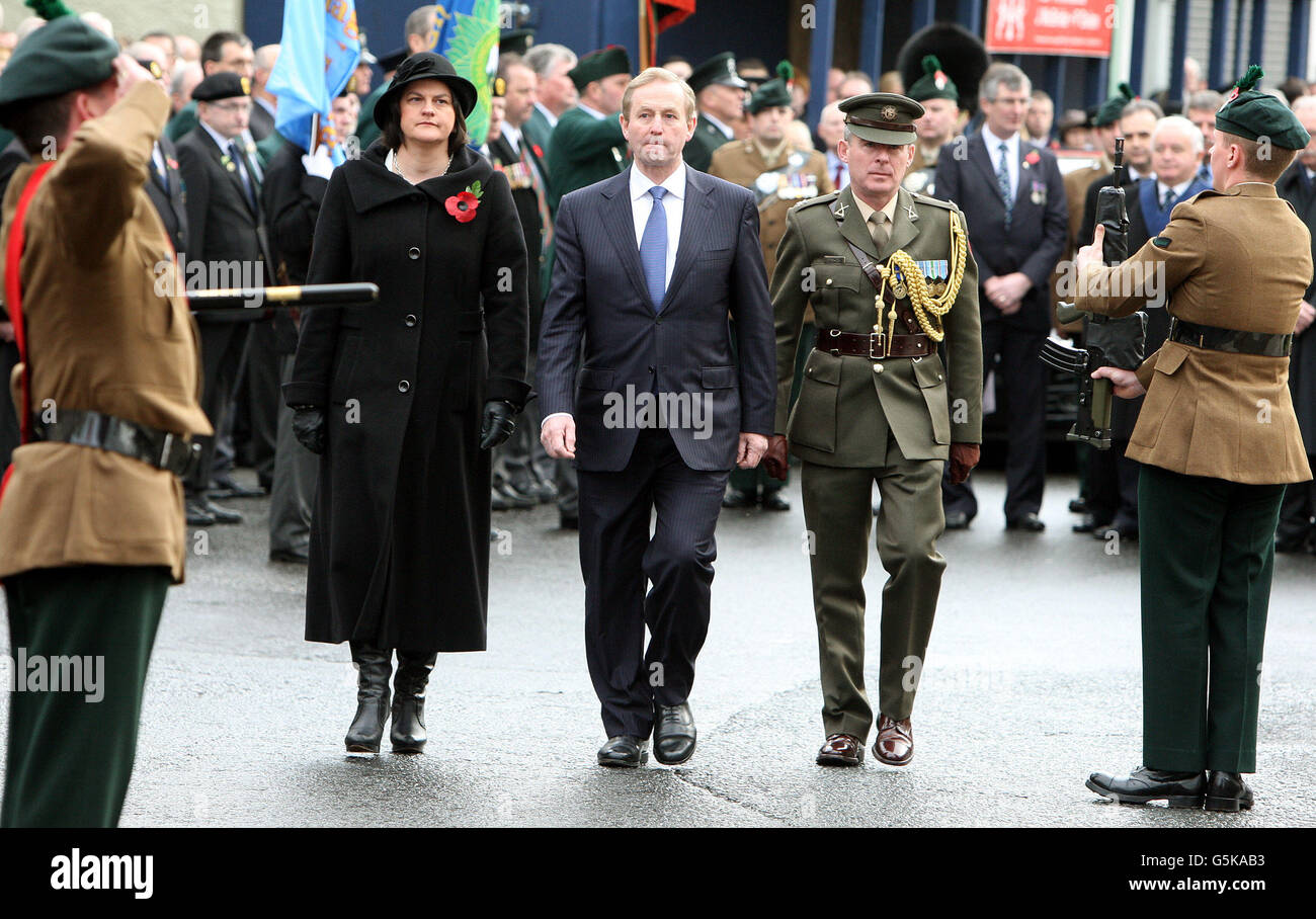 Taoiseach Enda Kenny (centre) with Stormont Minister Arlene Foster (left) attending a commemoration ceremony at Enniskillen cenotaph, on the 25th anniversary of the IRA Poppy Day bomb attack which claimed the lives of 12 people. Stock Photo