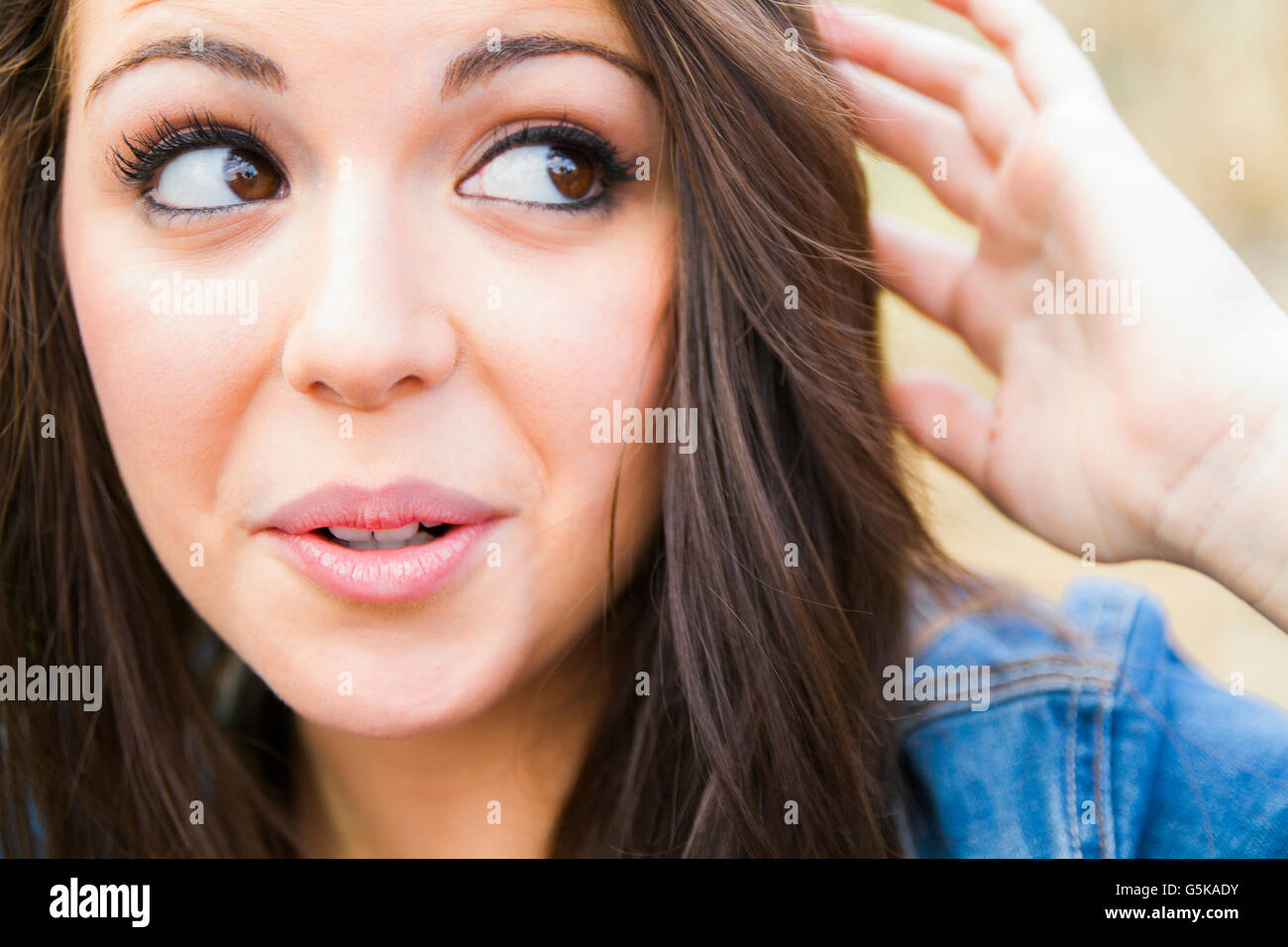 Hispanic woman with quizzical expression Stock Photo