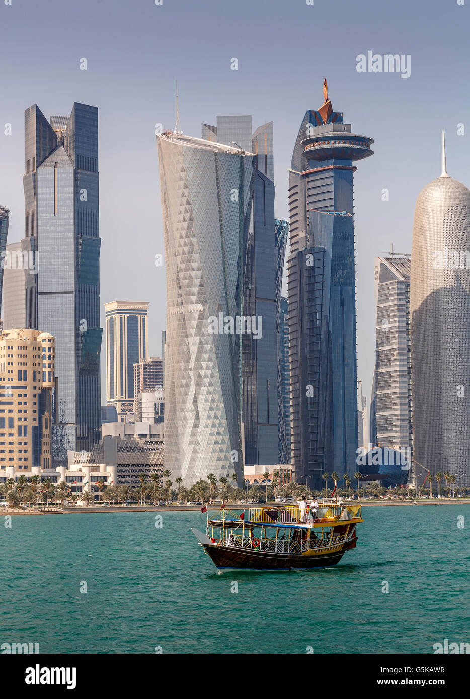 Boat floating near Doha skyline, Doha, Qatar Stock Photo Alamy