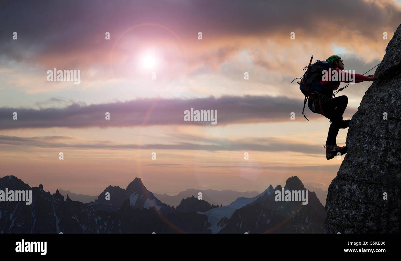 Caucasian climber scaling mountain in remote landscape Stock Photo - Alamy