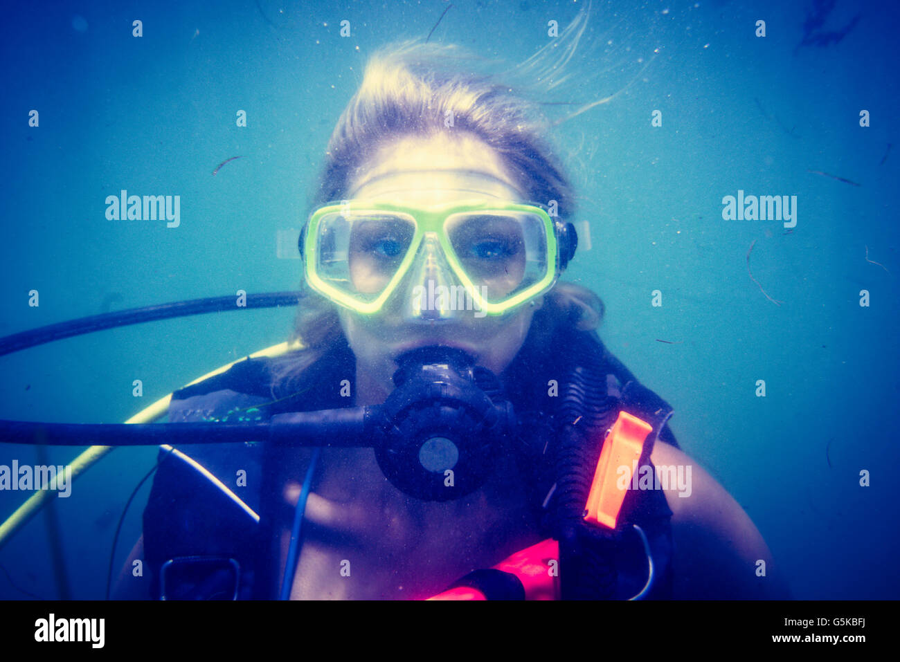 Caucasian diver swimming in ocean Stock Photo