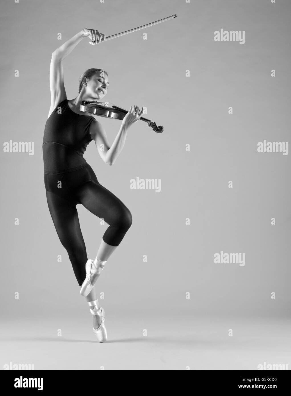Caucasian ballet dancer playing violin Stock Photo Alamy