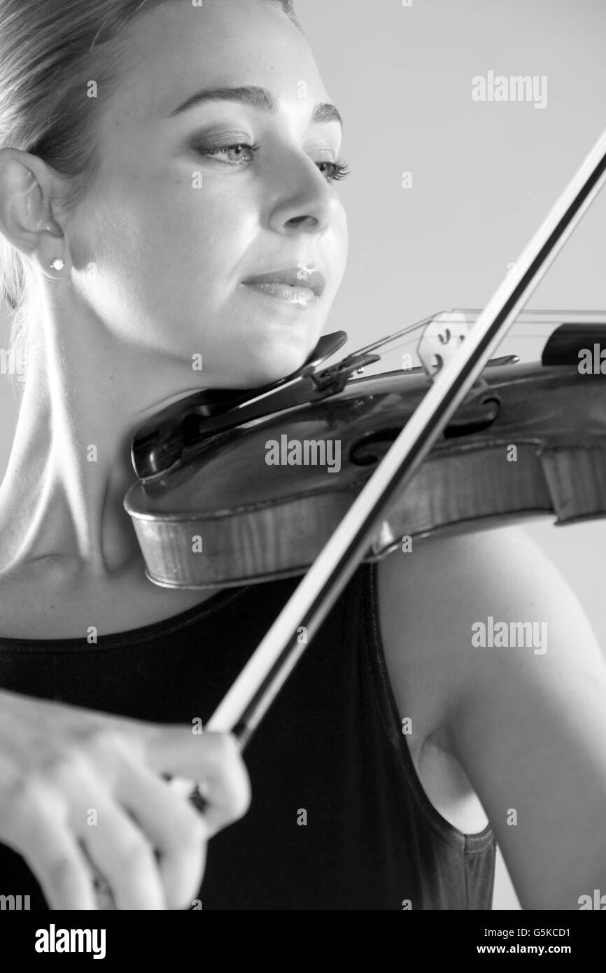 Caucasian musician playing violin Stock Photo - Alamy