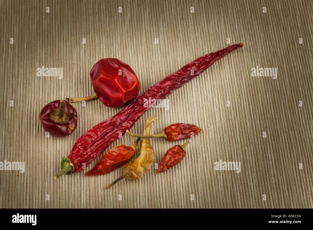 Different kinds of dried chili peppers. Dried red chili peppers. Hot