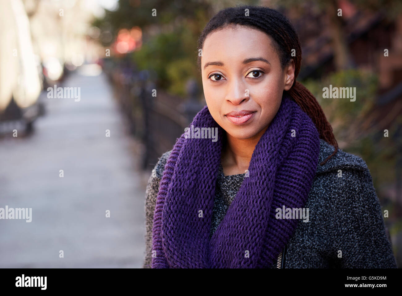 African American woman smiling outdoors Stock Photo