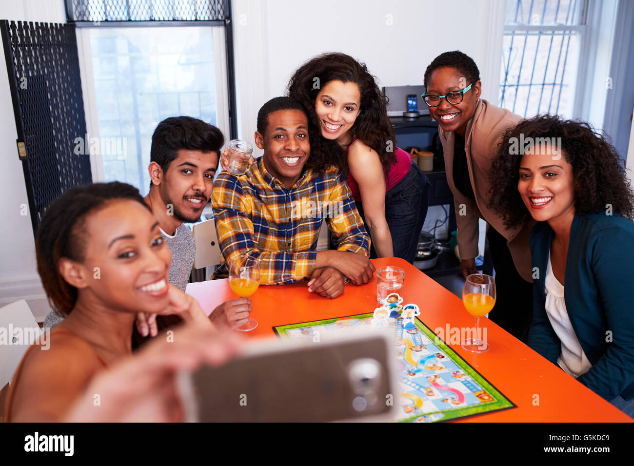 Friends taking selfie at party Stock Photo
