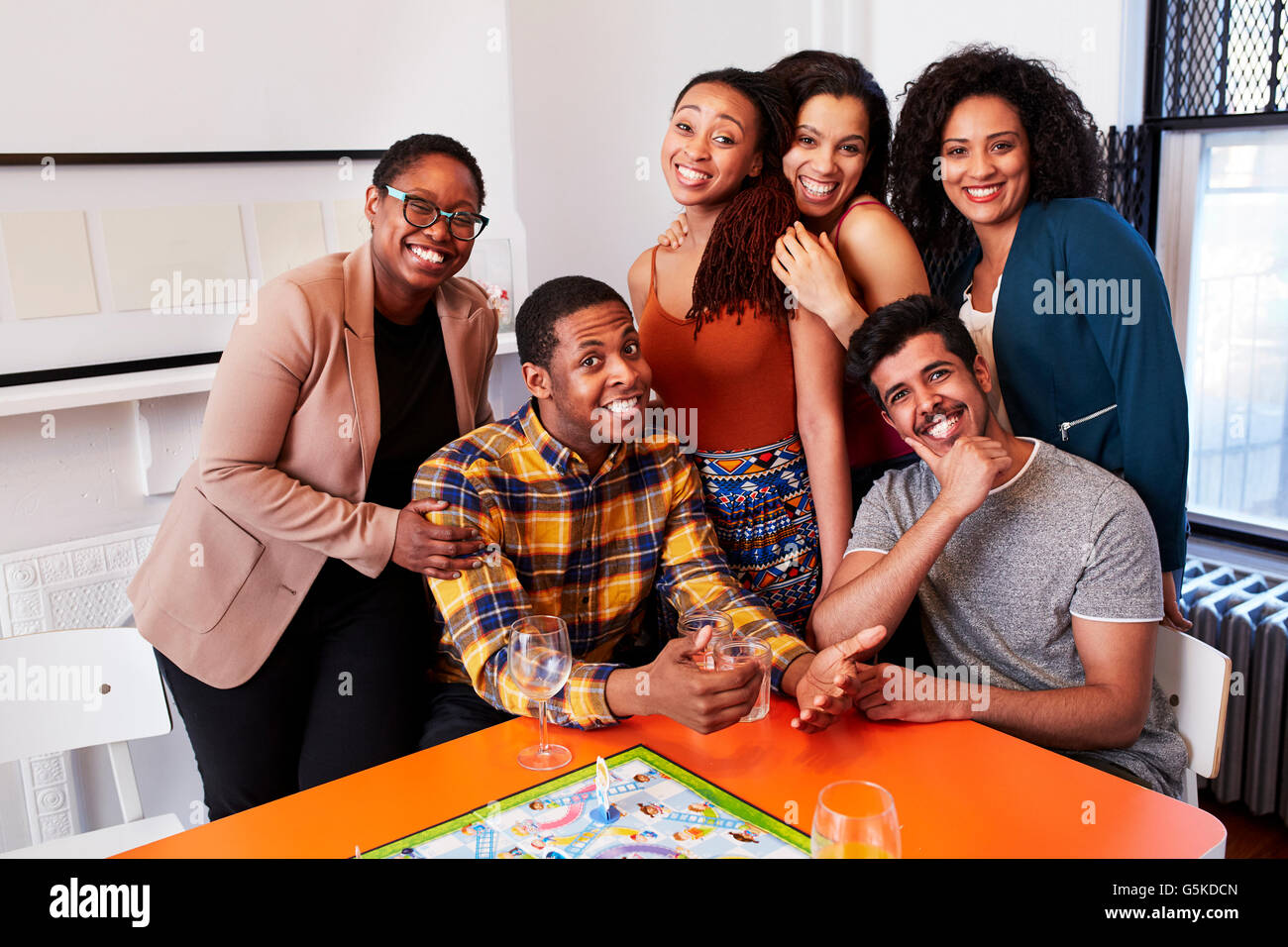 Friends smiling at party Stock Photo