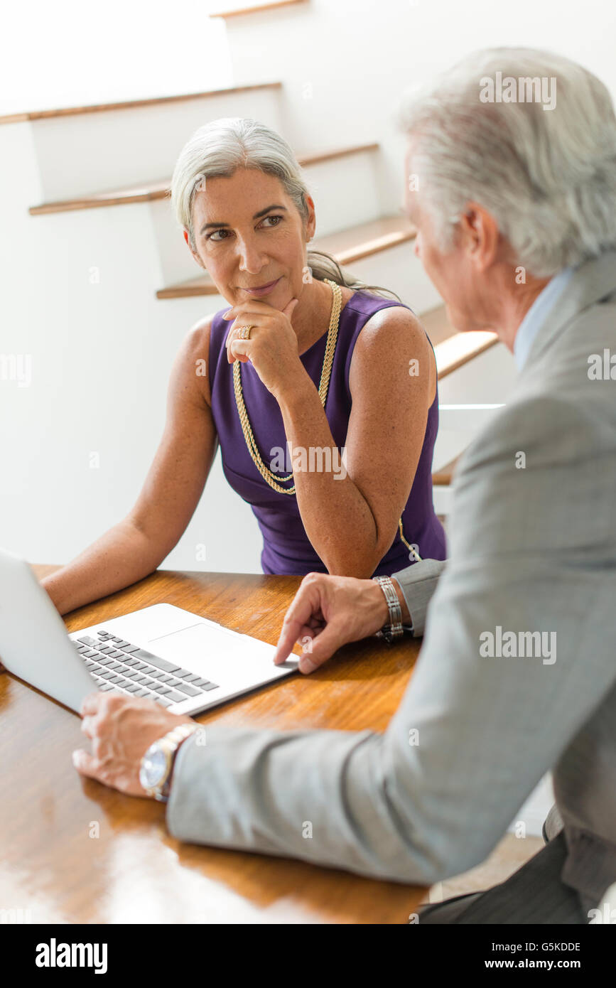 Caucasian couple using laptop Stock Photo