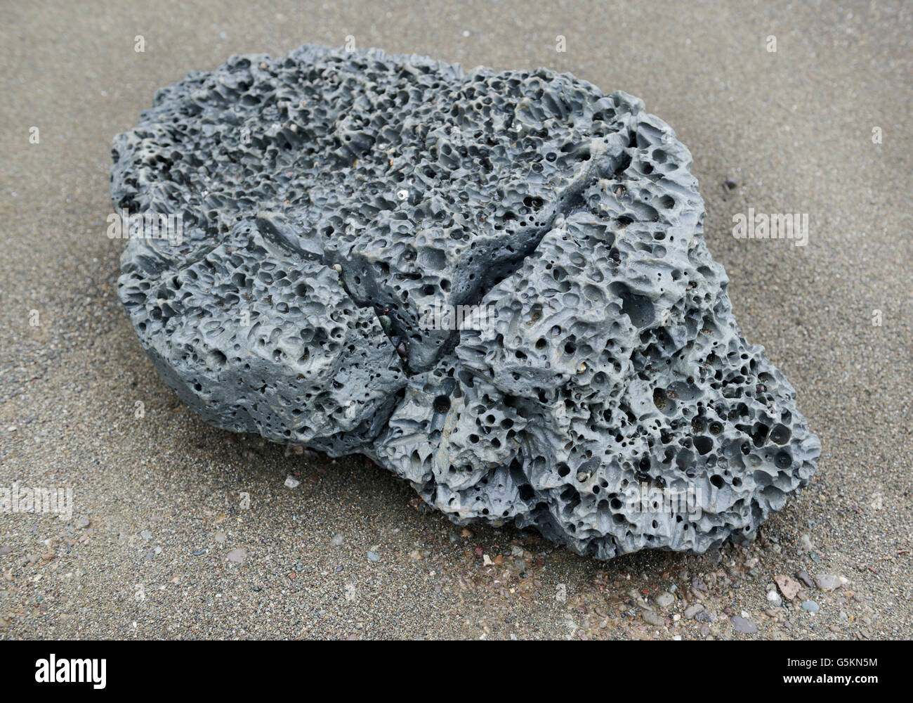 Volcanic igneous rock, scoria, on beach at Corcovado National Park, CR Stock Photo