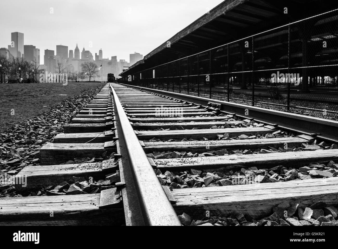 An abandoned railroad tracks with Manhattan in the background Stock Photo