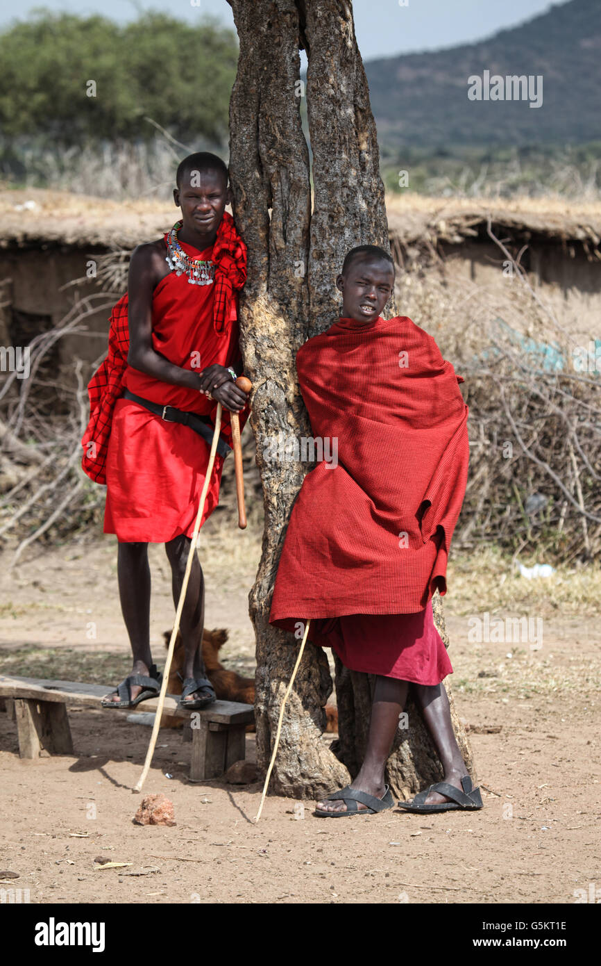 Two young men standing in a Masai Village in Masai Mara, Kenya, Africa. Stock Photo