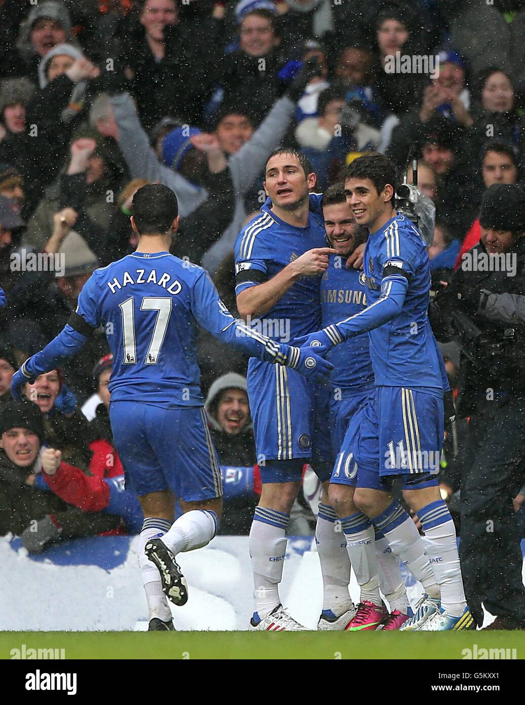 Chelsea's Juan Mata (second right) celebrates scoring his side's first goal of the game with teammates Stock Photo