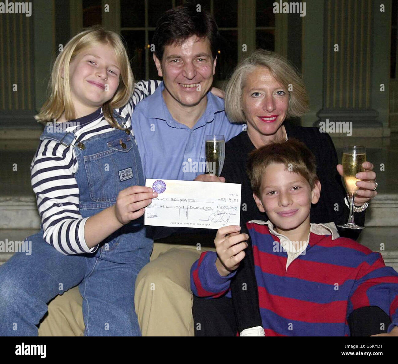 Robert Brydges the latest jackpot winner on Who Wants To Be A Millionaire? with wife Marilyn, his son Kempe, 10, and daughter Catherine, nine, holding the 1 million pound cheque at a press conference in London. * Mr Brydges, 47, of Holland Park, west London, became the fourth million pound winner of the show, which is due to be transmitted on 29/9/01. Stock Photo