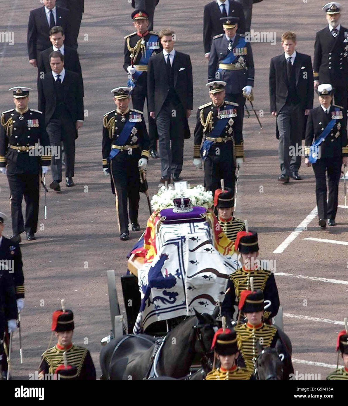 Members of the Royal Family including the Duke of York, the Prince of Wales, the Duke of Edinburgh, the Princess Royal, Princes Harry and William, Viscount Linley and Daniel Chatto, follow on behind the coffin of Queen Elizabeth, the Queen Mother. *...., during a procession Friday April 5, 2002, from the Queen's Chapel to Westminster Hall, where she will lie-in-state until her funeral at Westminster Abbey on Tuesday. Stock Photo