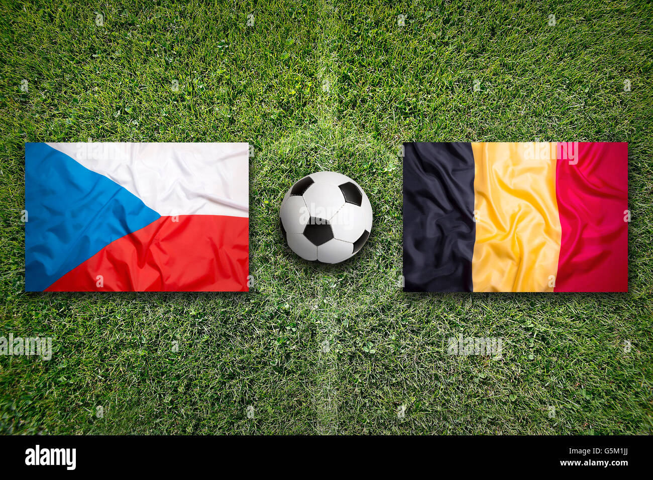 Czech Republic vs. Belgium flags on green soccer field Stock Photo