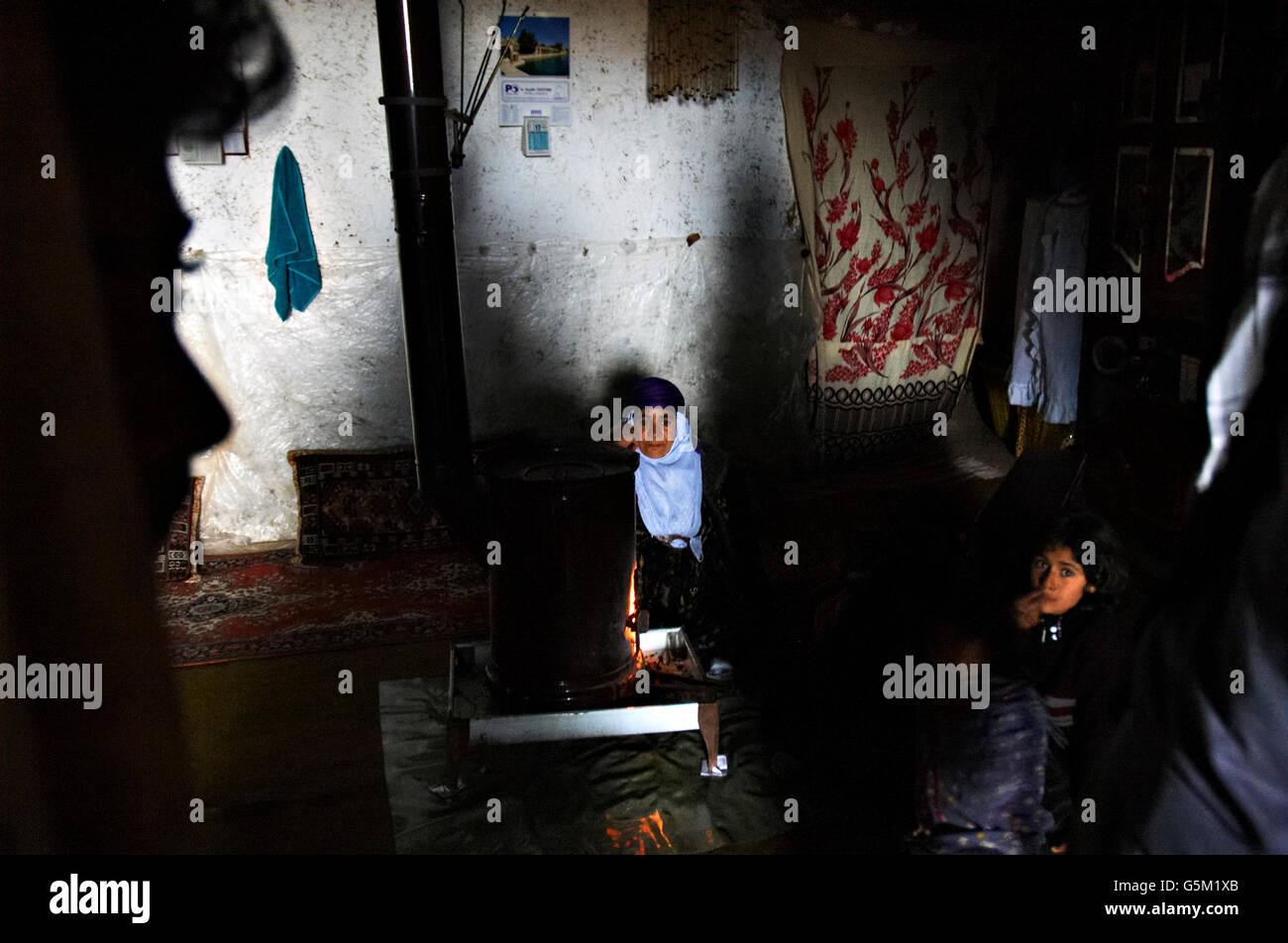 A Kurdish family who live in a cave. Ceylanpinar, Sanliurfa. Stock Photo