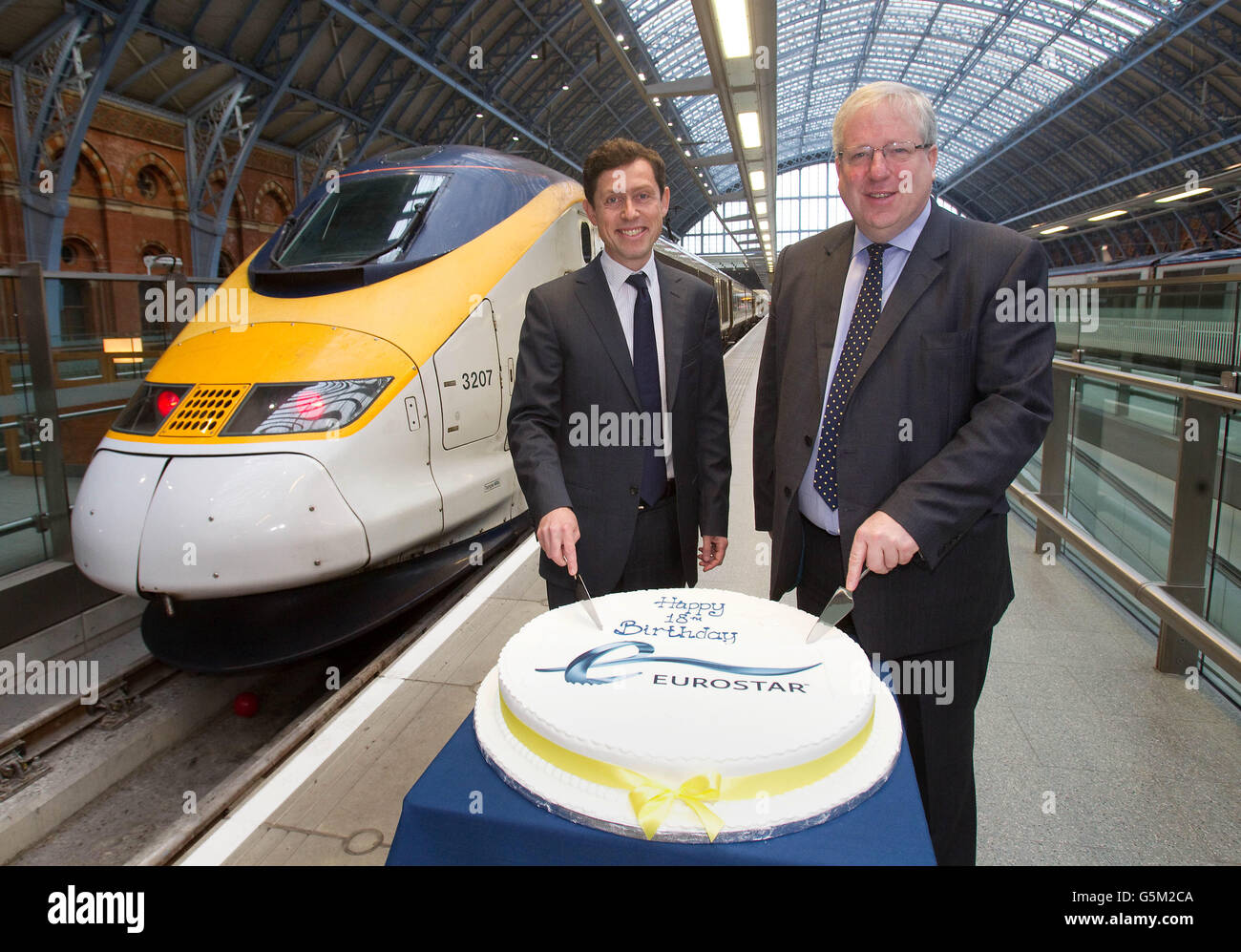 Eurostar CEO Nicolas Petrovic (left) and Transport Secretary Patrick McLoughlin at St Pancras train station in London for Eurostar's 18th birthday celebrations. Stock Photo