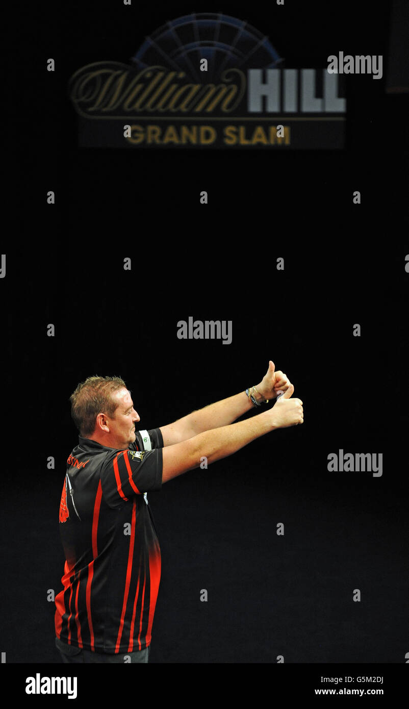Darts - Grand Slam of Darts - Wolverhampton Civic Hall. Dean Winstanley takes the applause after his victory overSimon Whitlock. Stock Photo