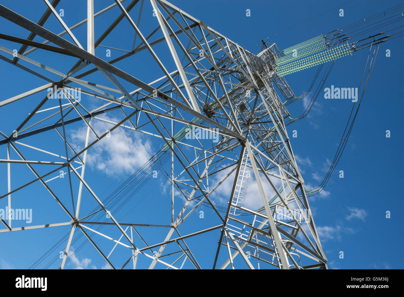 High-voltage tower on the blue sky background Stock Photo - Alamy