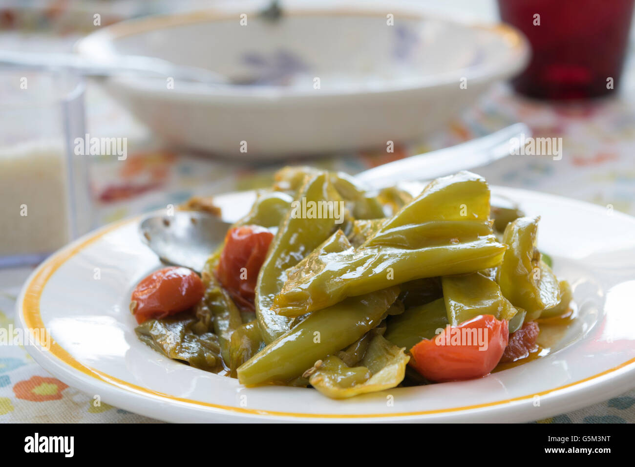 peperonata or fried peppers italian style with friarelli and cherry tomatoes Stock Photo