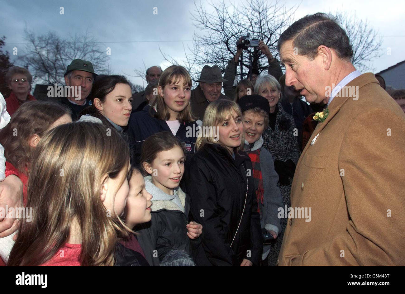 The Prince of Wales talks to local children during a visit to the village of Knayton, North Yorkshire where he was meeting farmers affected by the foot and mouth disease. * Earlier, in a move to highlight the role of the pub in rural communities, he callied in at the Craven Heifer hotel in the Yorkshire Dales village of Stainforth, where he joined locals for a drink. Stock Photo