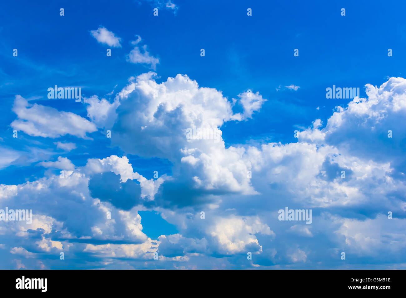 White clouds in the blue summer sky Stock Photo - Alamy