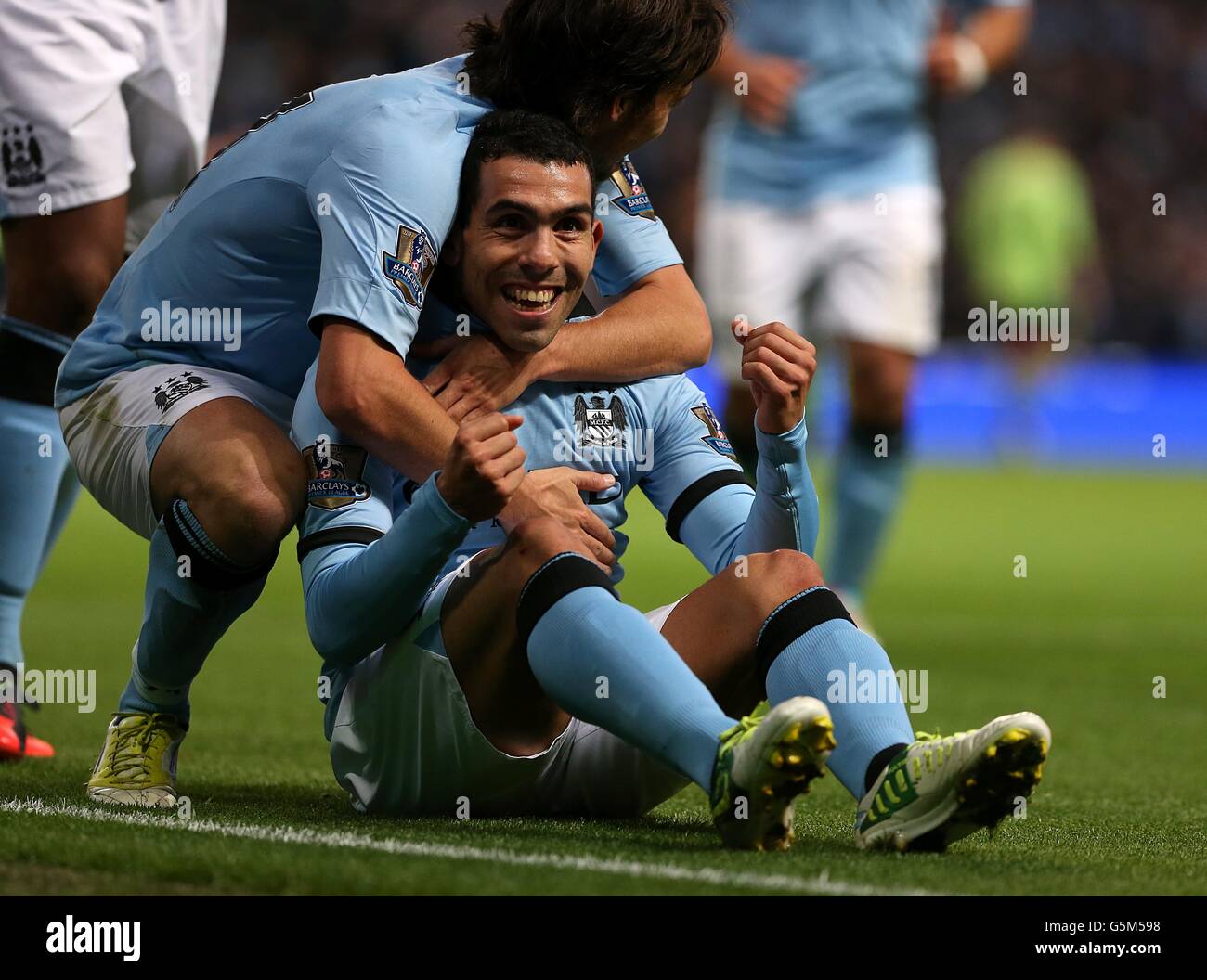 Manchester City s Carlos Tevez Celebrates Scoring His Team s Third Goal 