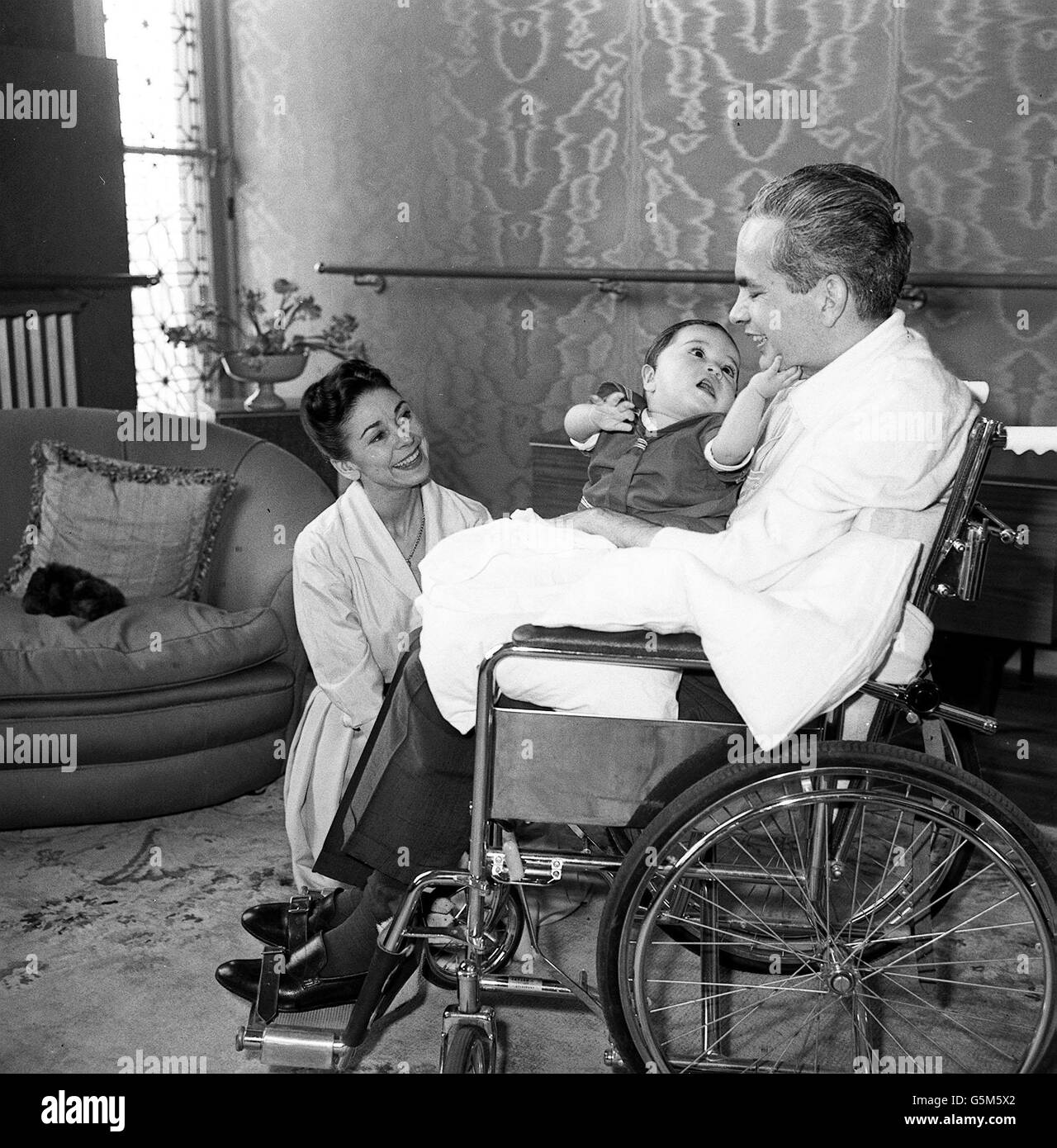 Dr Roberto Arias with his wife ballerina Dame Margot Fonteyn and their friend's son at their home in Kensington, London. Arias was shot in Panama nine months ago. Stock Photo