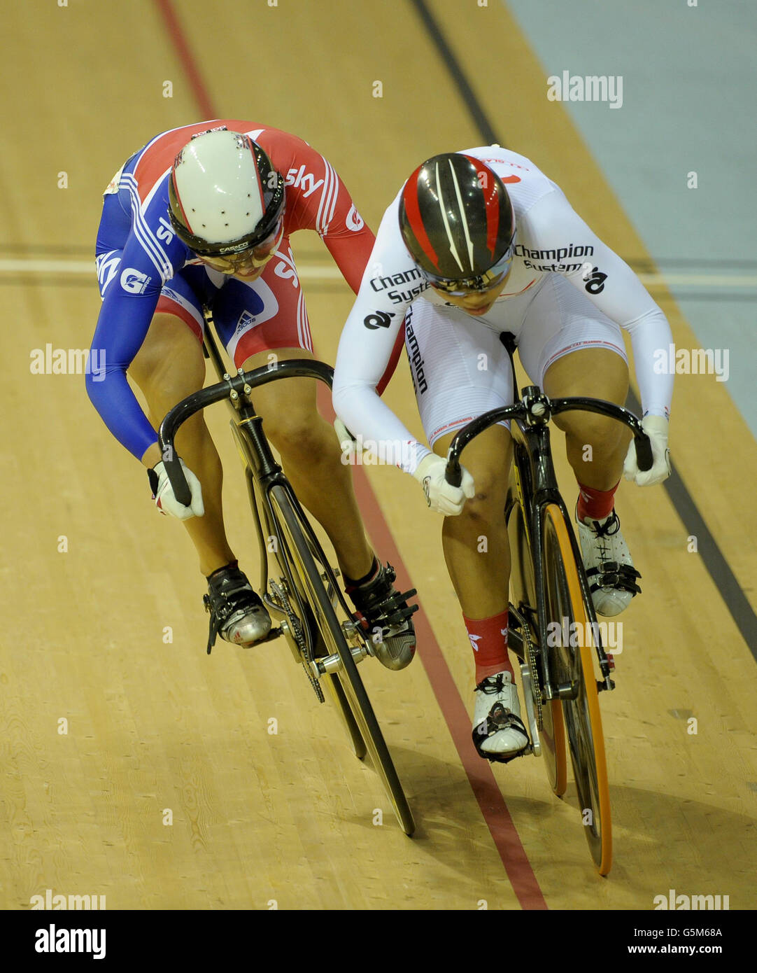 Great Britain's Becky James (left) with Hong Kong's Wai Sze Lee in the Women's Sprint Bronze Medal Race 2 during the UCI Track Cycling World Cup at the Sir Chris Hoy Velodrome in the Emirates Arena, Glasgow. Stock Photo