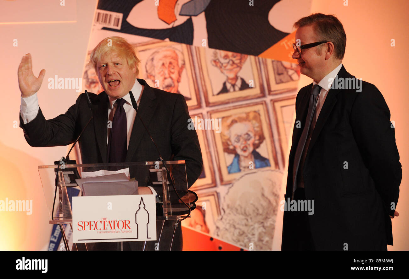 London Mayor Boris Johnson collects his award for Politician of the Year as Education Secretary Michael Gove looks on at this year's Spectator Magazine's Parliamentarian of the Year Awards, in central London. Stock Photo