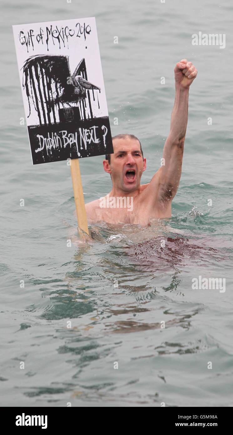 Swimmer Paul Wright joins protesters as they gather at the 40 foot bathing pool in Sandycove to voice their safety fears for plans to allow exploration for oil in Dublin Bay off Dalkey. PRESS ASSOCIATION Photo. Picture date: Saturday November 24, 2012. Photo credit should read: Niall Carson/PA Wire Stock Photo