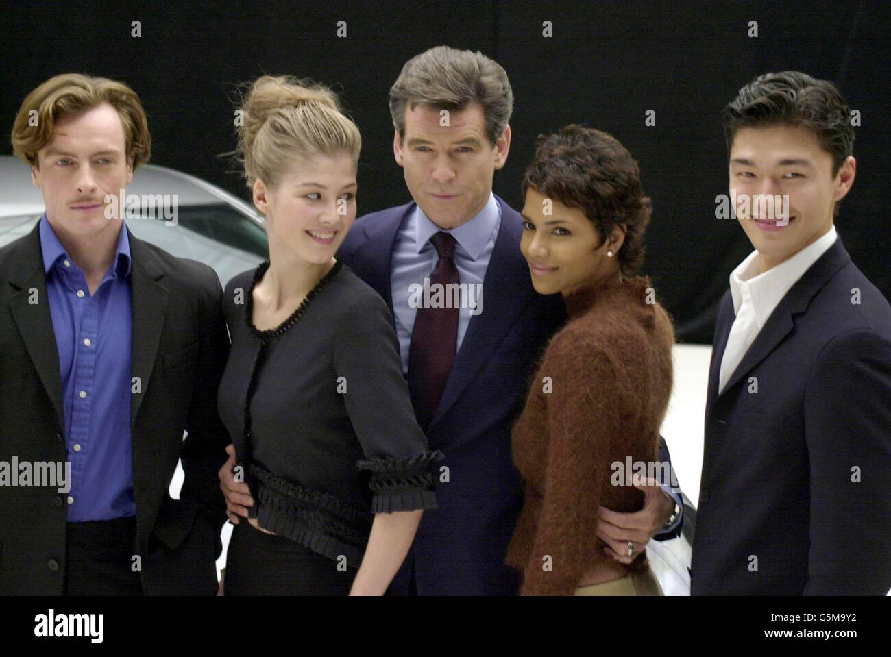 Stars of the film, Toby Stephens, Rosamund Pike, Pierce Brosnan, Halle Berry and Rick Yune during a photocall at Pinewood Studios, north of London for 'Bond 20', the working title for the latest film which starts production next week. Stock Photo