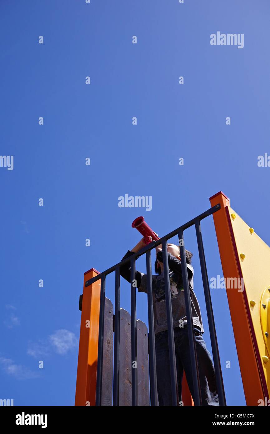 Boy playing in playground Stock Photo